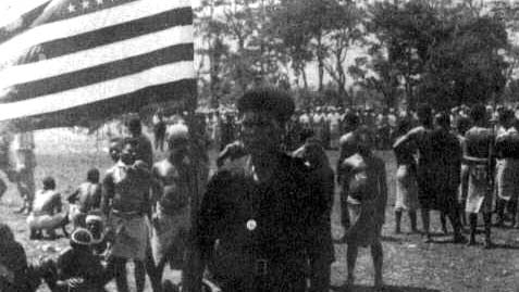 Flag ceremony for 9FS given by New Guinea natives - 1943
