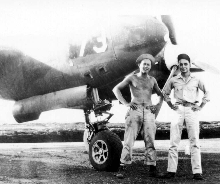 E.J. Sparkman posing with P-38 #73 - Dobodura 1943