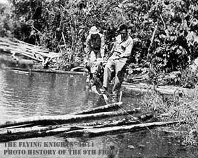 Men crossing river/creek